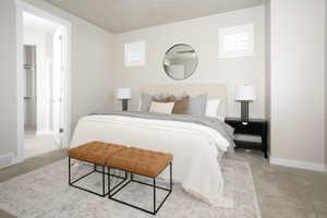 Carpeted room featuring light-toned walls and white trim