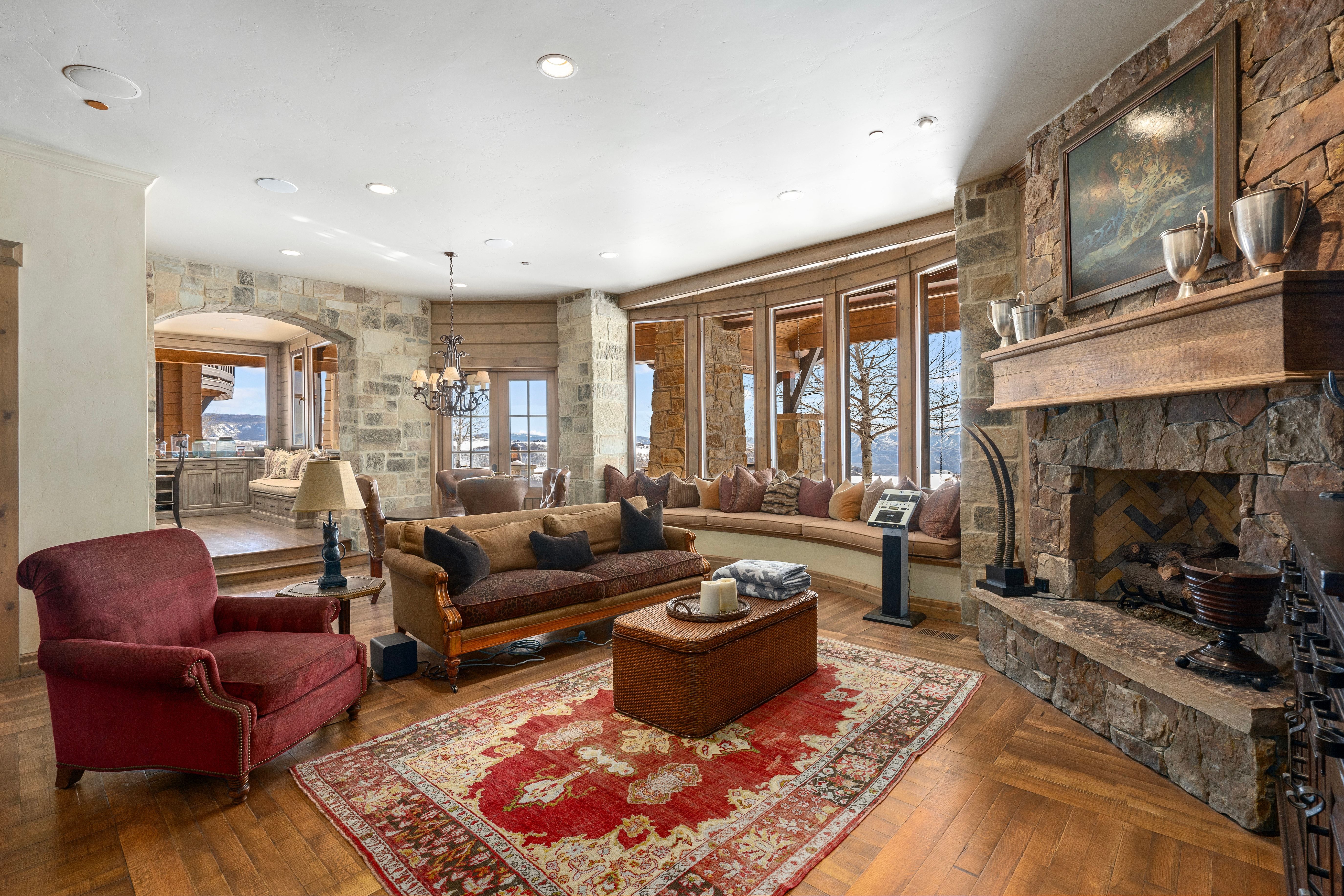Stone fireplace with a substantial timber mantel