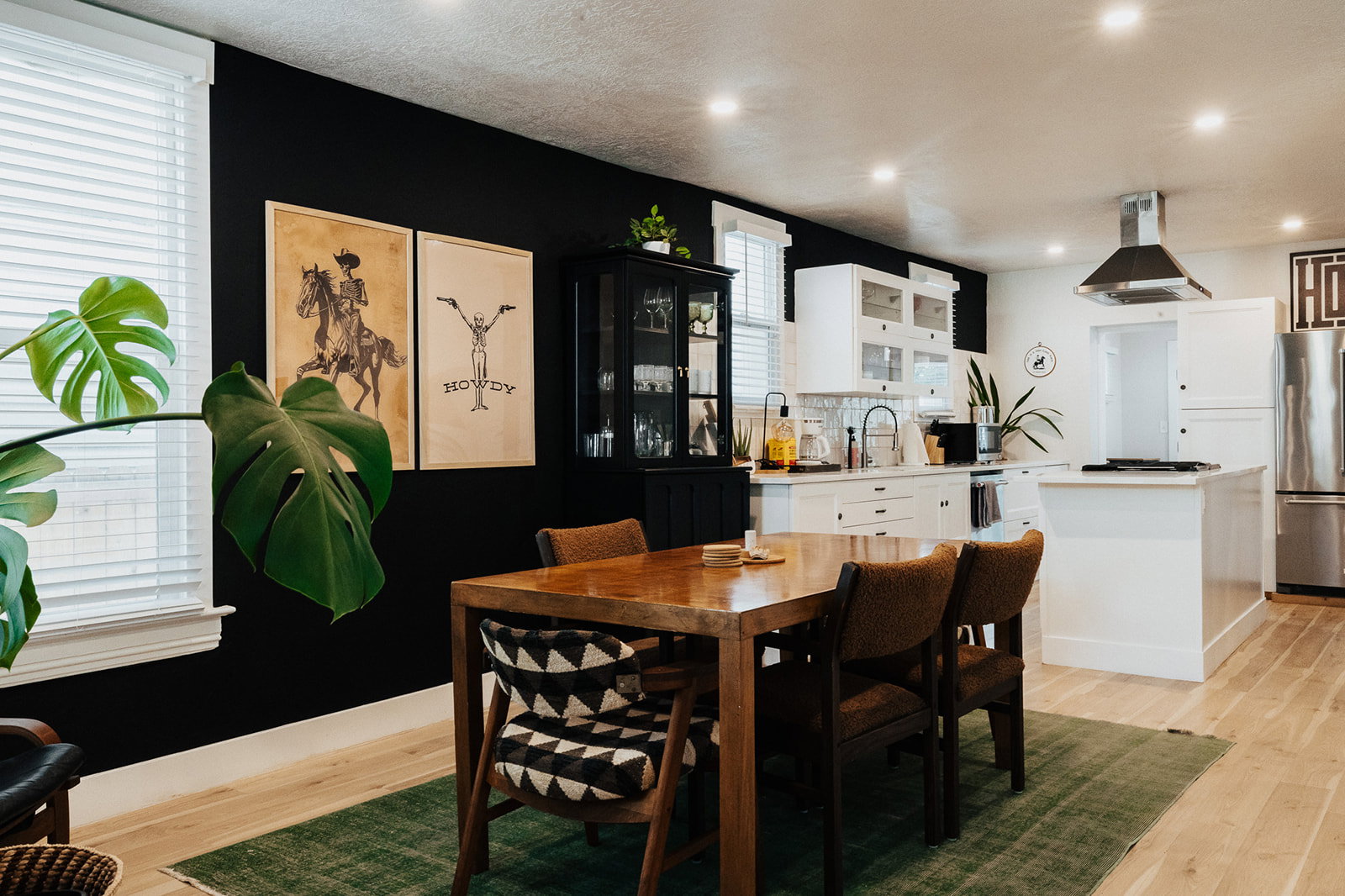 Open-concept kitchen and dining area featuring light wood-finish flooring