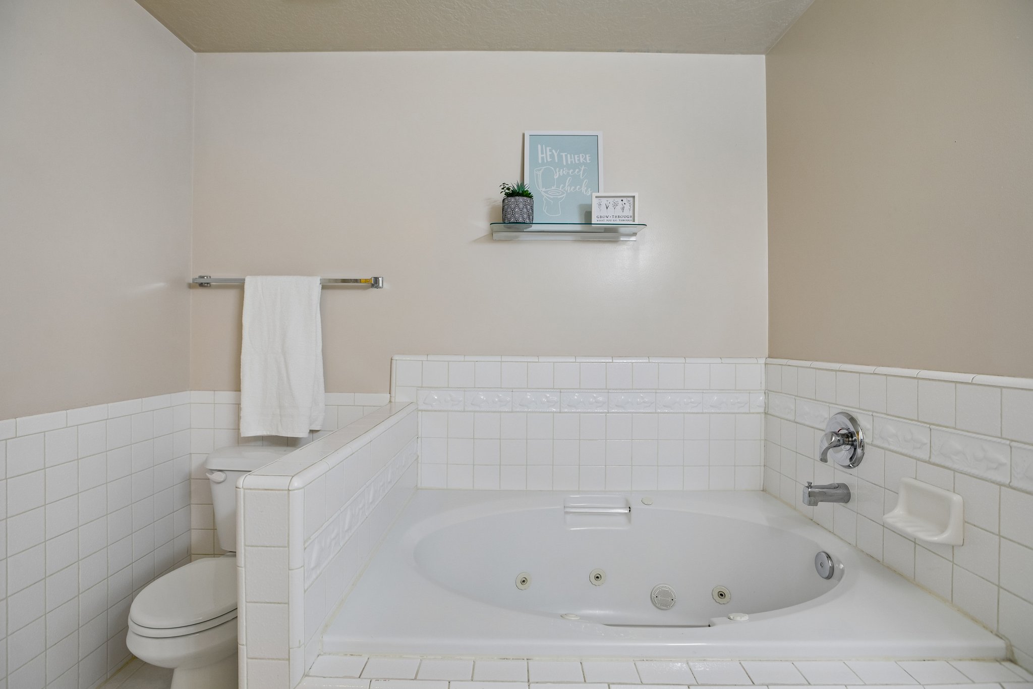 Soaking tub with integrated jets and chrome fixtures