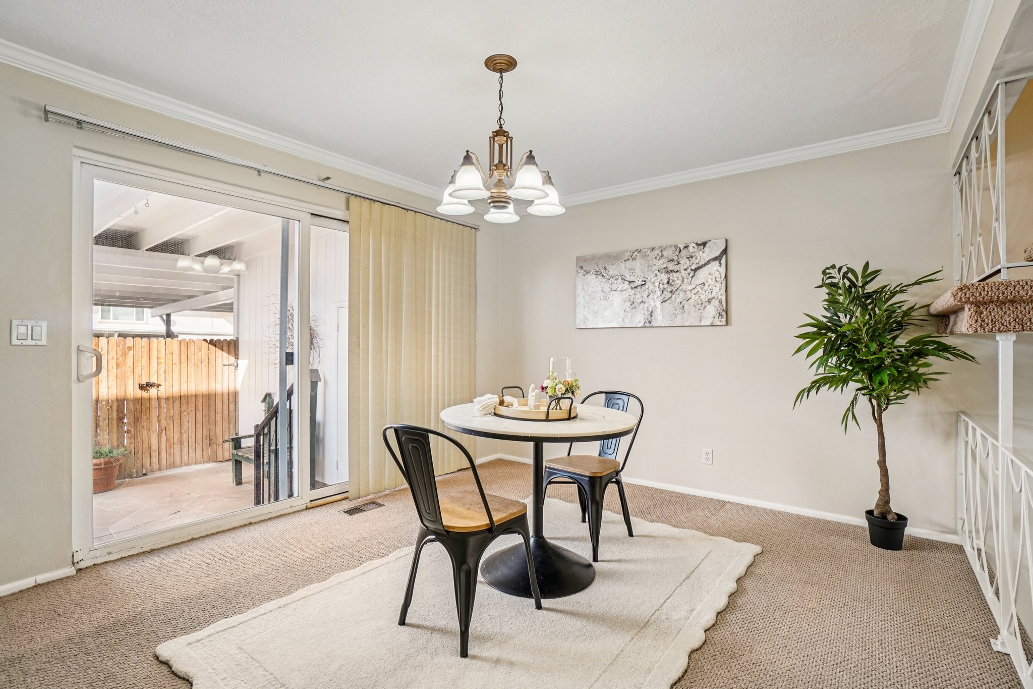 Dining area featuring sliding glass doors opening to a private patio