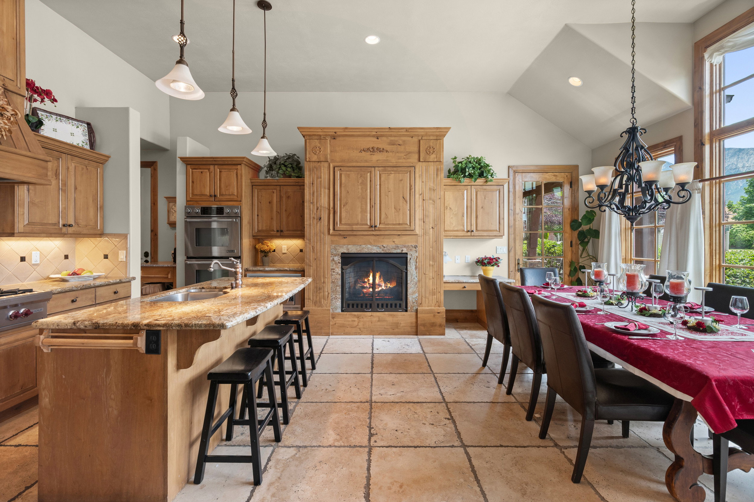 Kitchen/Dining Area with Fireplace, Wolf Gas Range and Double Ovens