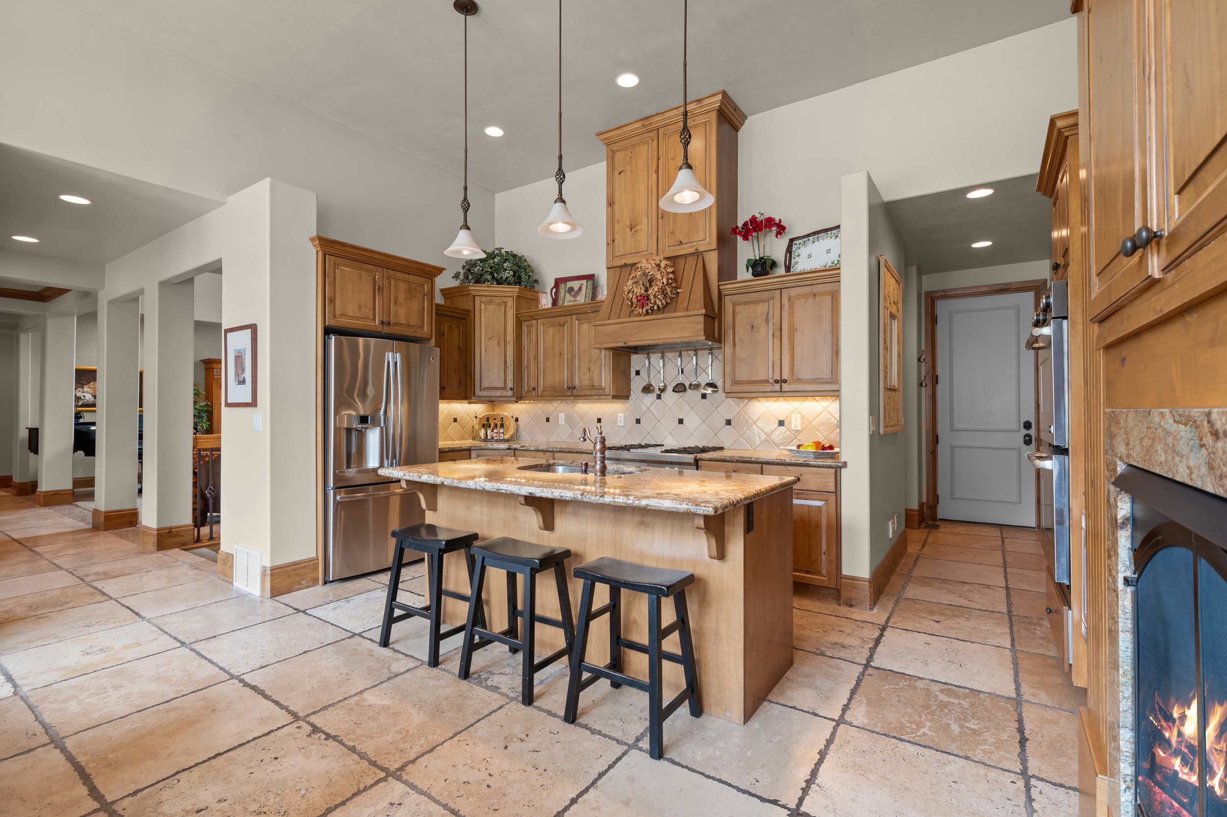 Kitchen – White Door Leads to Single Car Garage with Extra Length