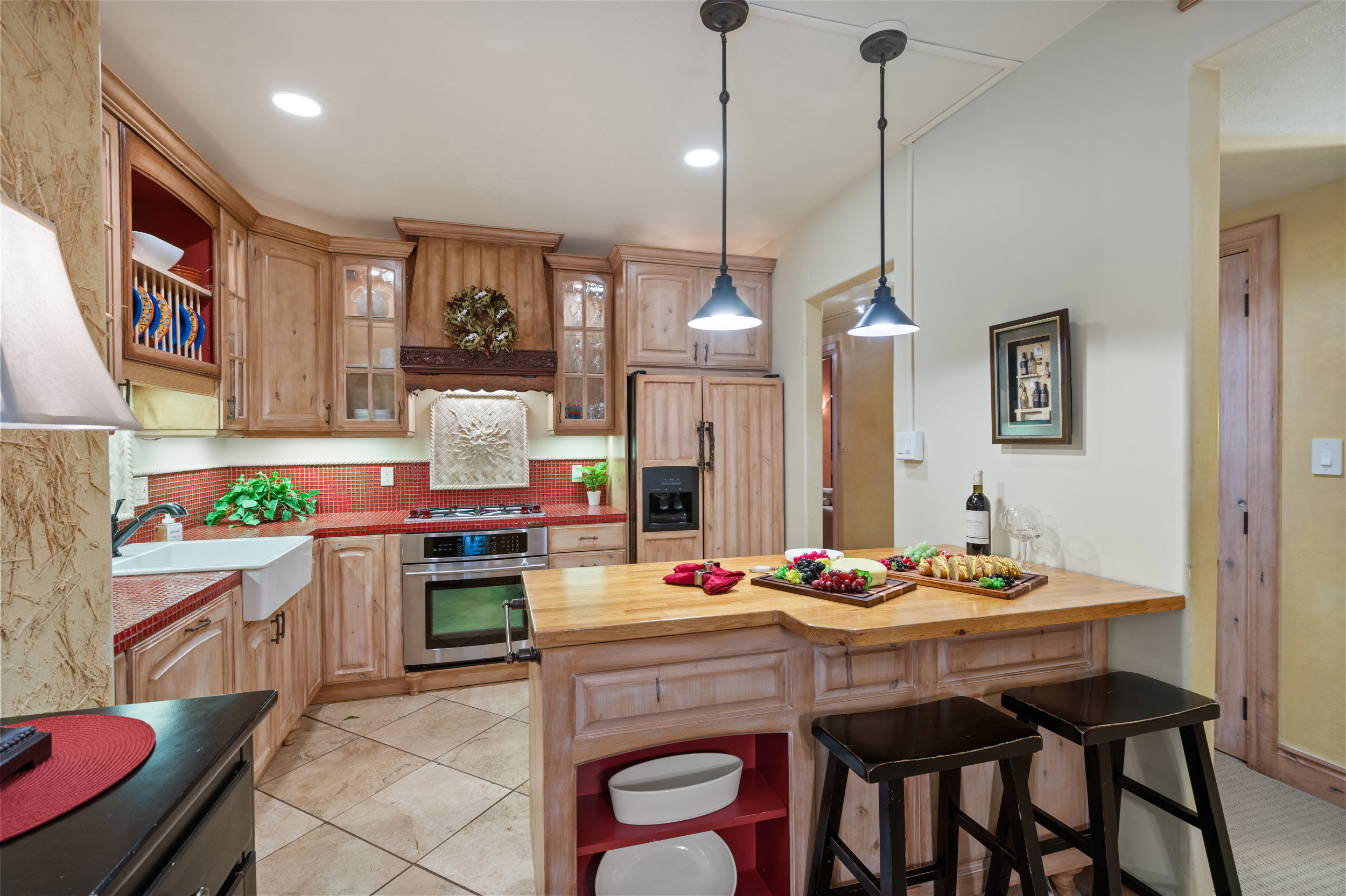 Kitchen with Custom Cabinetry and Wood Paneled Refrigerator