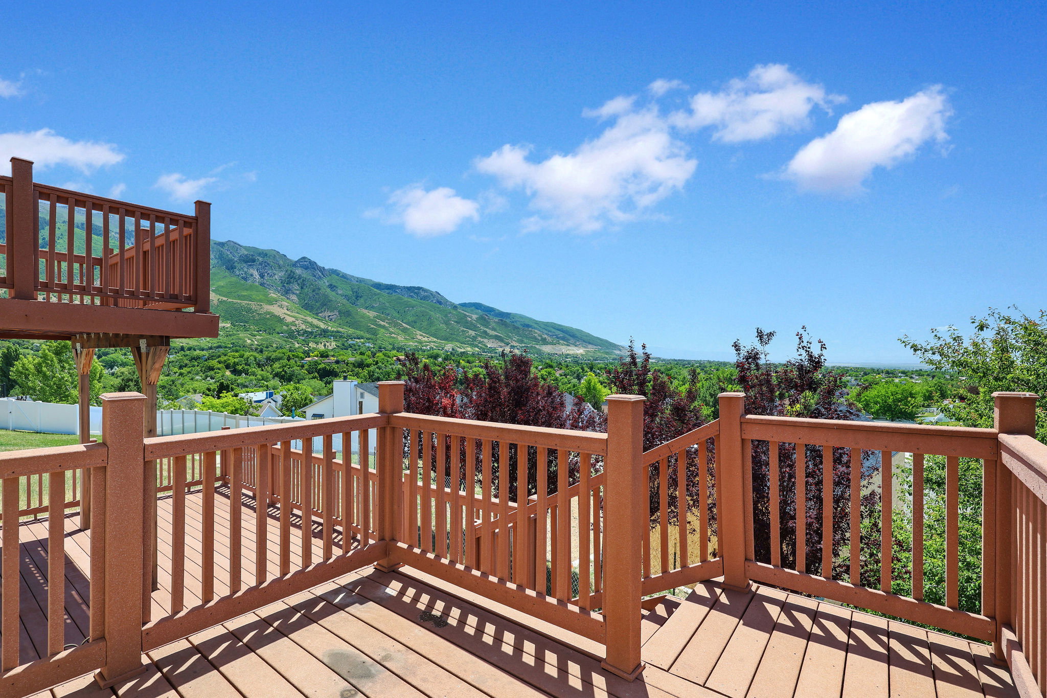 Multi-level wood deck featuring a balustrade railing system