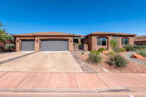 Southwestern-style stucco exterior with stone accents and a tiled roof