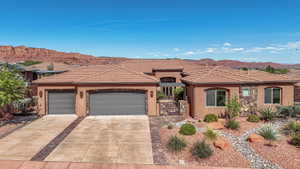 Southwestern-style stucco residence with a multi-car garage