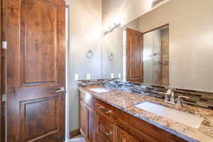 Double vanity with granite countertops and two undermount sinks