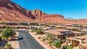 Residential neighborhood featuring a paved street and abundant desert landscaping