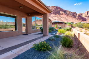 Covered patio featuring a concrete surface with decorative dark gray banding