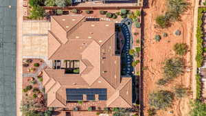 Expansive property featuring a multi-gabled roofline and solar panel installation