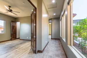 Hallway with large windows offering exterior views