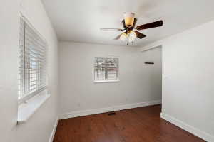 Warm wood-finish flooring complements white walls and trim