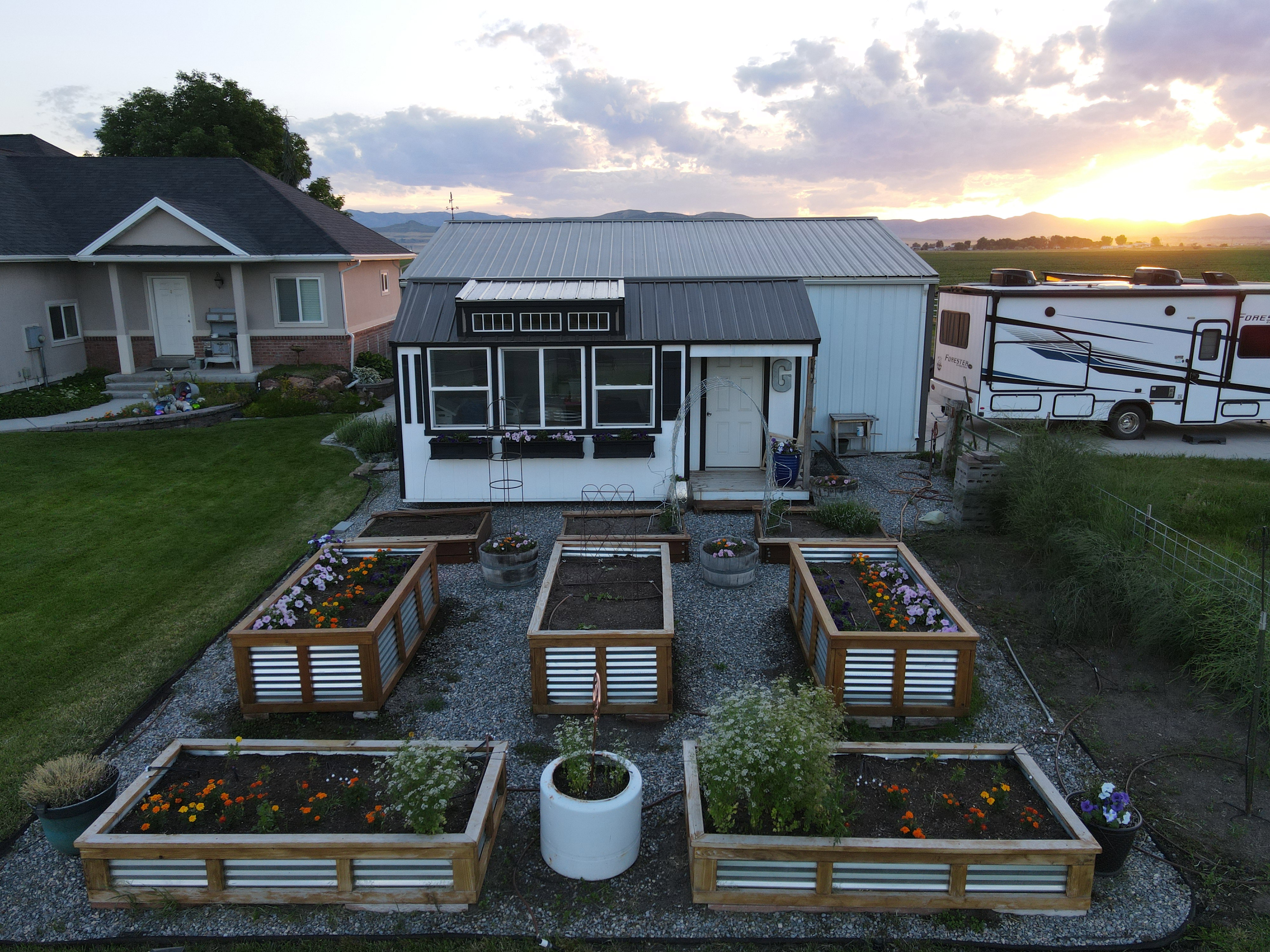 Garden shed with raised garden beds.