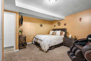 Carpeted room with a ceiling-mounted light fixture