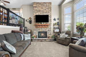 Stone-clad fireplace with a wood mantle and built-in hearth