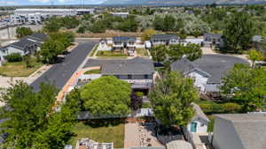 Expansive property featuring a multi-level deck, a detached shed, and mature perimeter trees