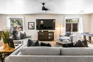 Spacious living area featuring neutral wall tones and recessed lighting