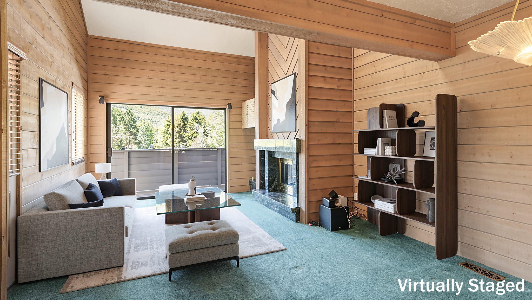 Wood-paneled living area featuring a fireplace with a stone surround, a large glass sliding door, and vaulted ceilings with exposed wood beams