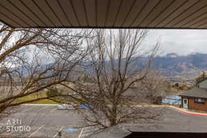 Mountain and valley scenery from a balcony with a ribbed soffit