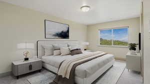 Bedroom with neutral wall tones and a window framing a natural landscape