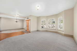 Bay window with arched frames and plantation shutters