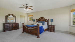 Spacious room featuring light-colored walls and grey carpeting