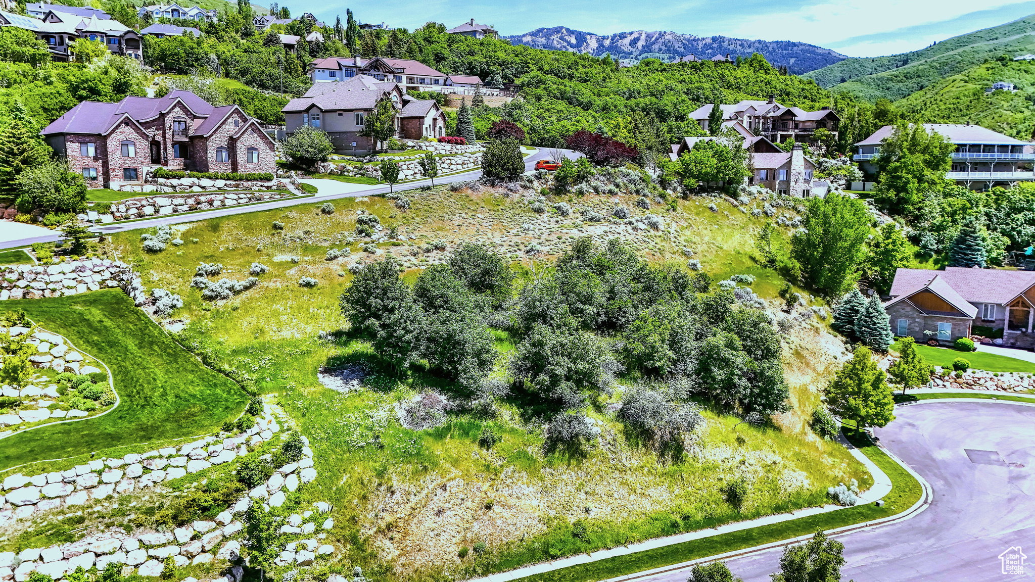 Expansive residential terrain featuring varied landscaping and surrounding natural environment