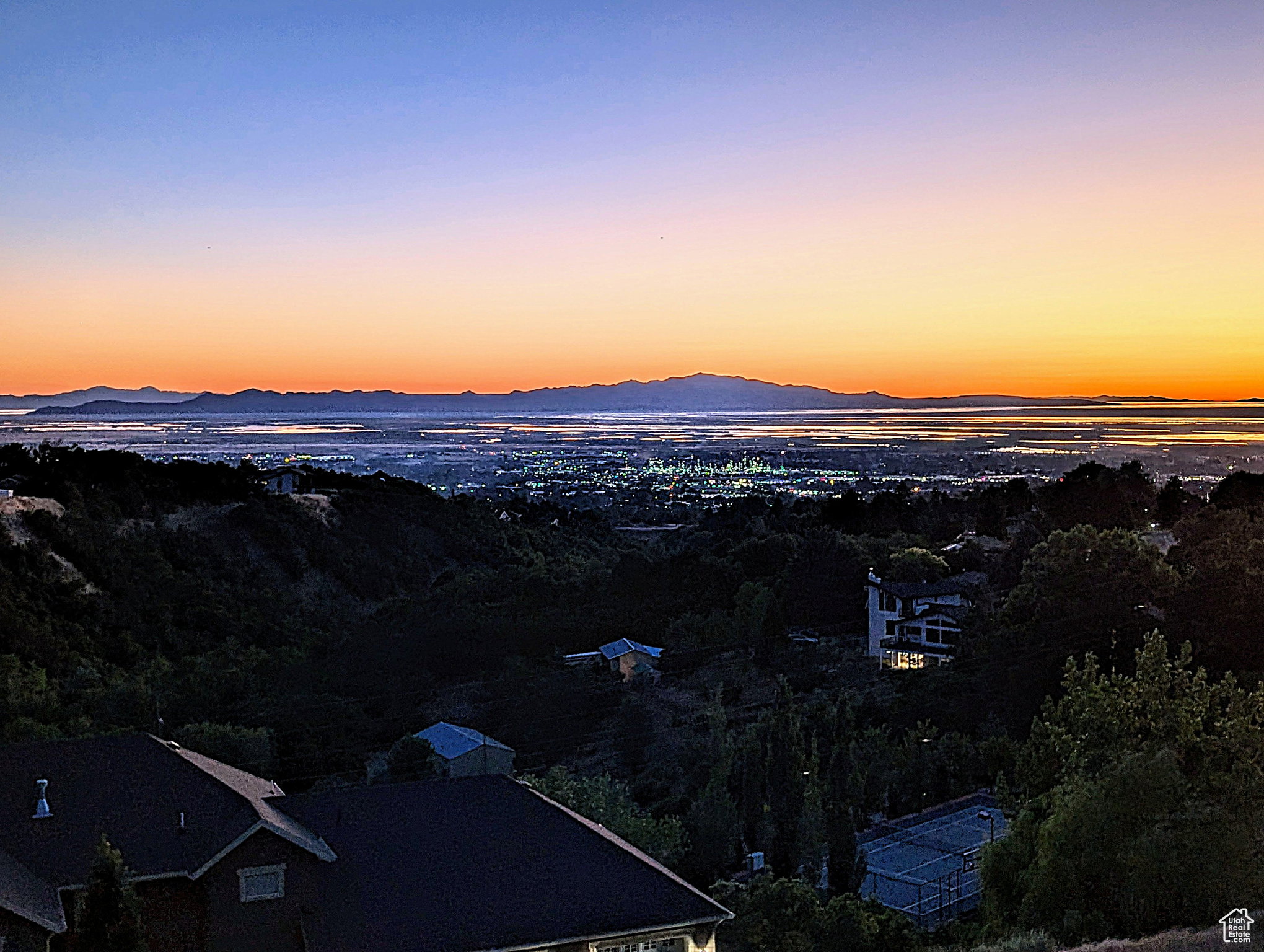 Expansive mountain and city scenery from a high vantage point