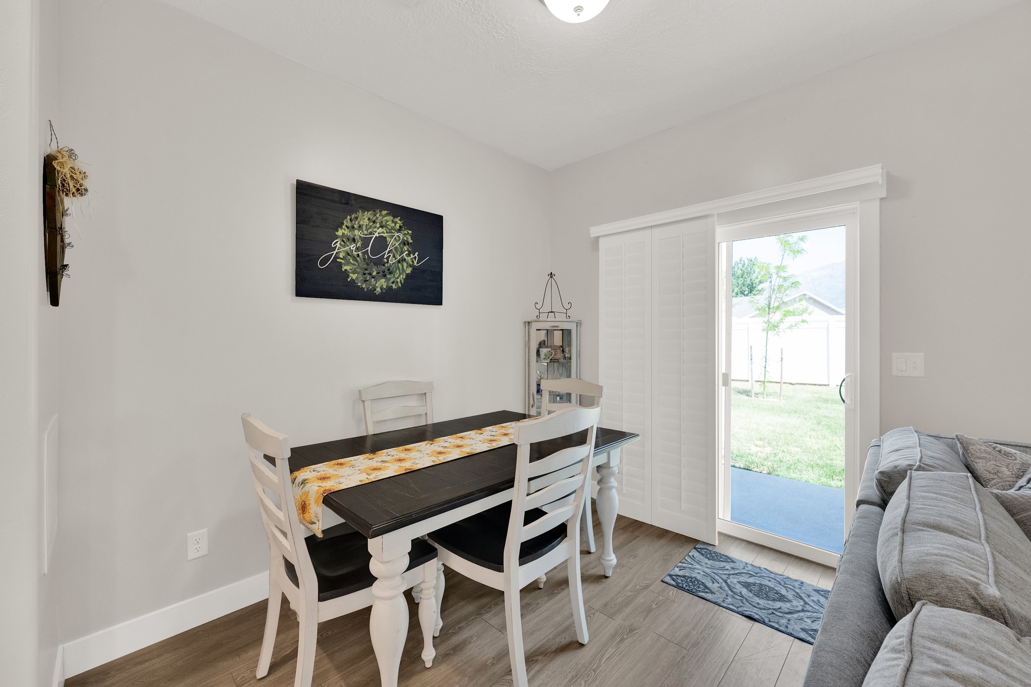 Dining area featuring wood-finish flooring and light gray wall paint