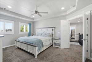 Plush carpeting throughout with white plantation shutters and recessed lighting