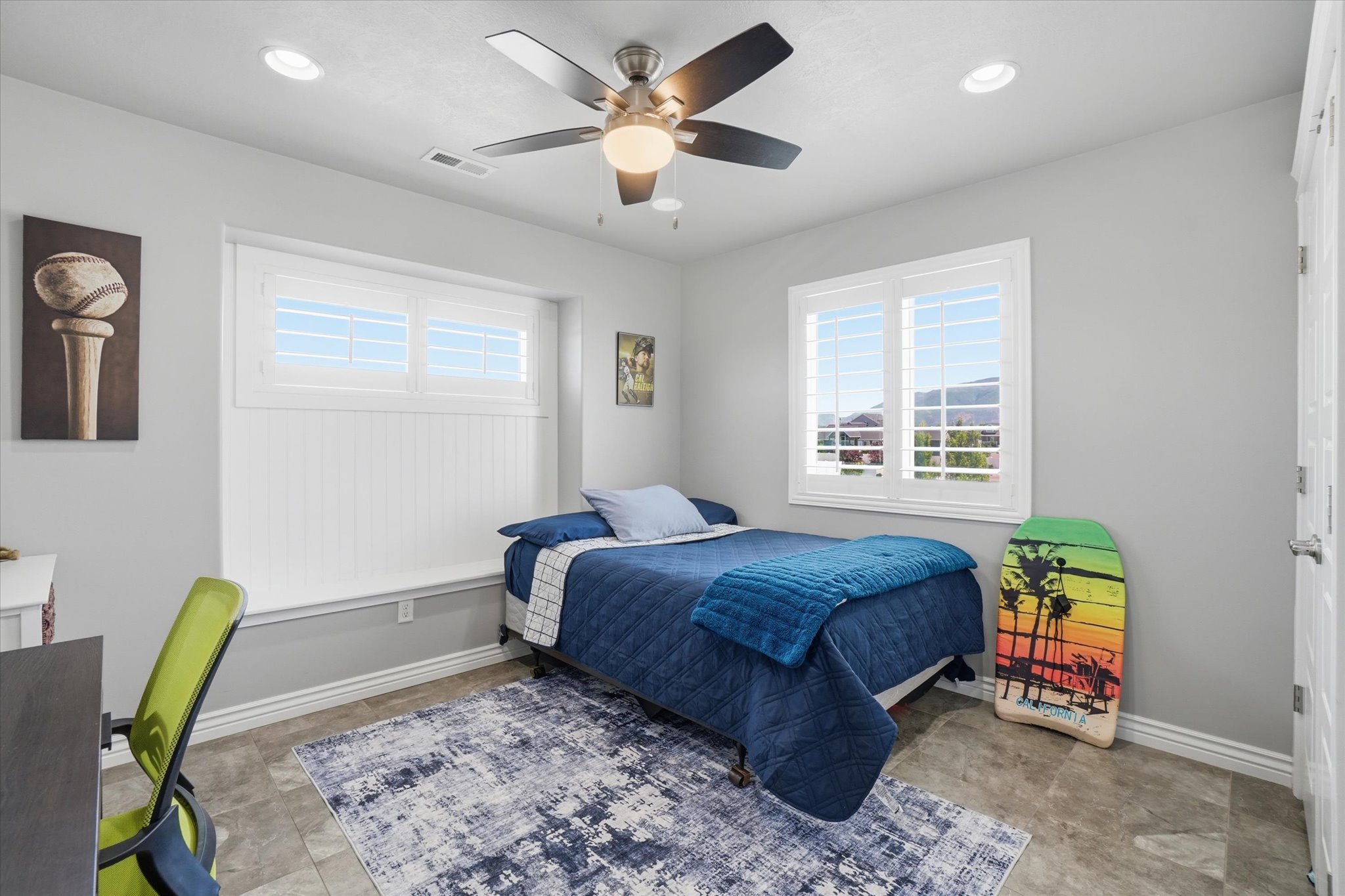 Bright room featuring gray walls and durable tile flooring