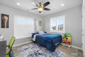 Bright room featuring gray walls and durable tile flooring