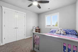 Neutral painted walls complement the carpeted flooring and white trim