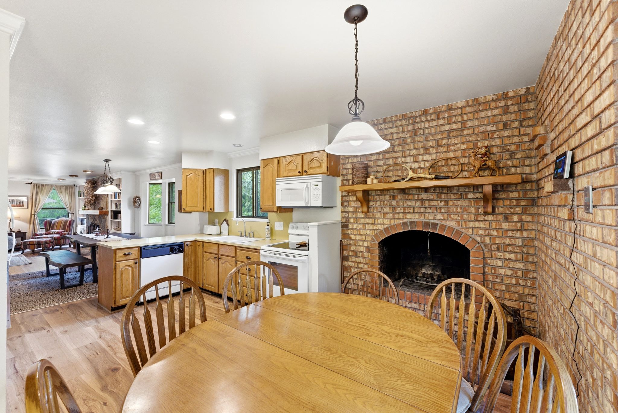 Brick fireplace with a wood mantel
