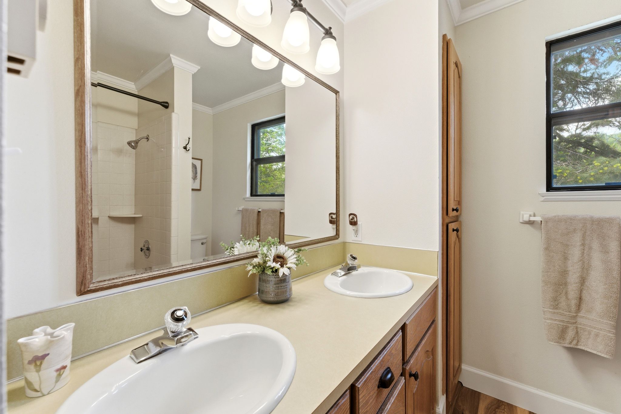 Dual vanity with integrated sinks and chrome fixtures