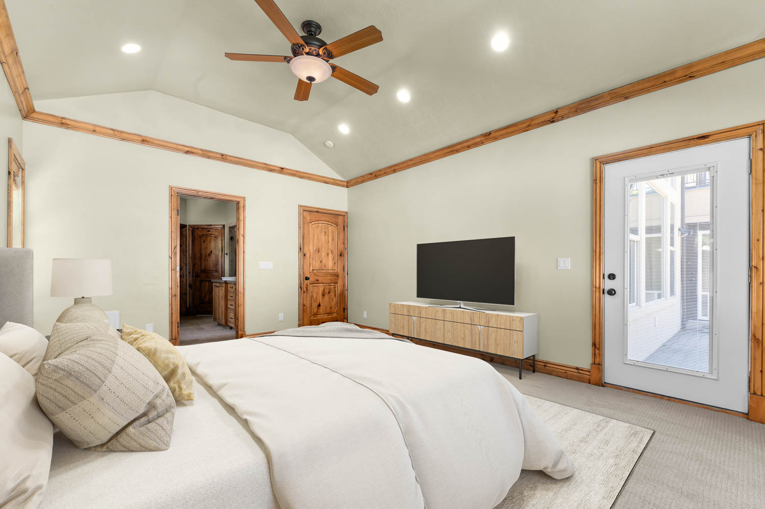 Master bedroom. .Vaulted ceiling featuring a wood-finish ceiling fan and recessed lighting
