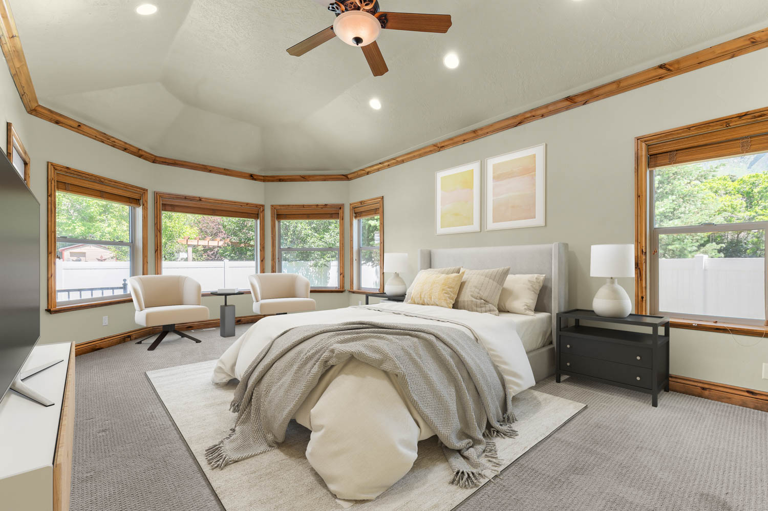 Master bedroom. Bay window with wood-trim framing and a trey ceiling featuring recessed lighting and a ceiling fan