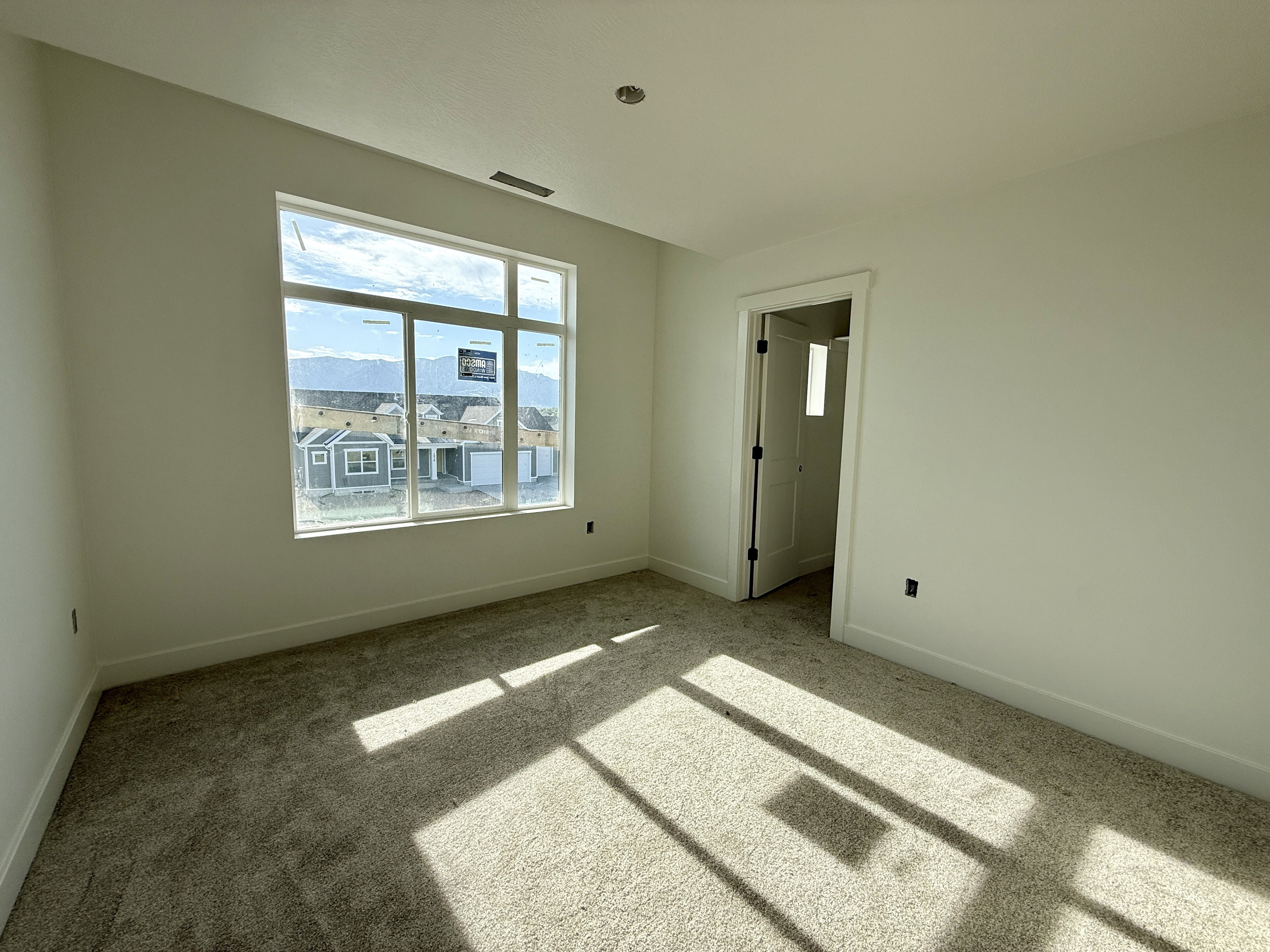 Expansive window offering distant mountain scenery