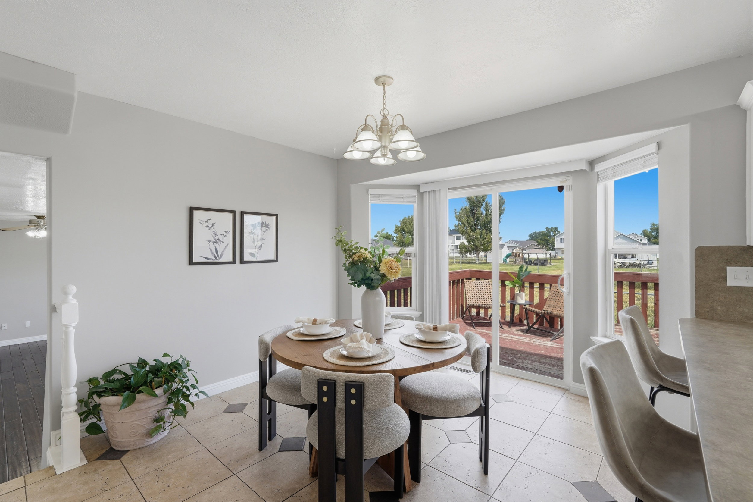 Dining area with bay windows and tile flooring