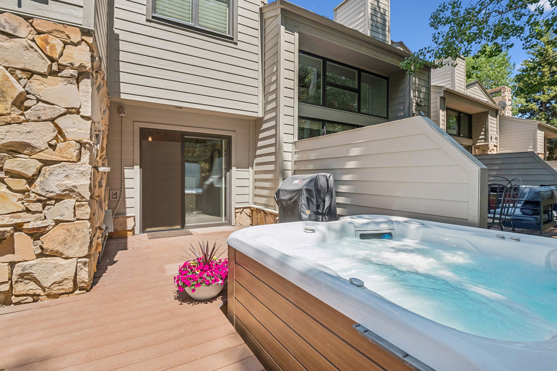 Outdoor hot tub on a composite decking patio