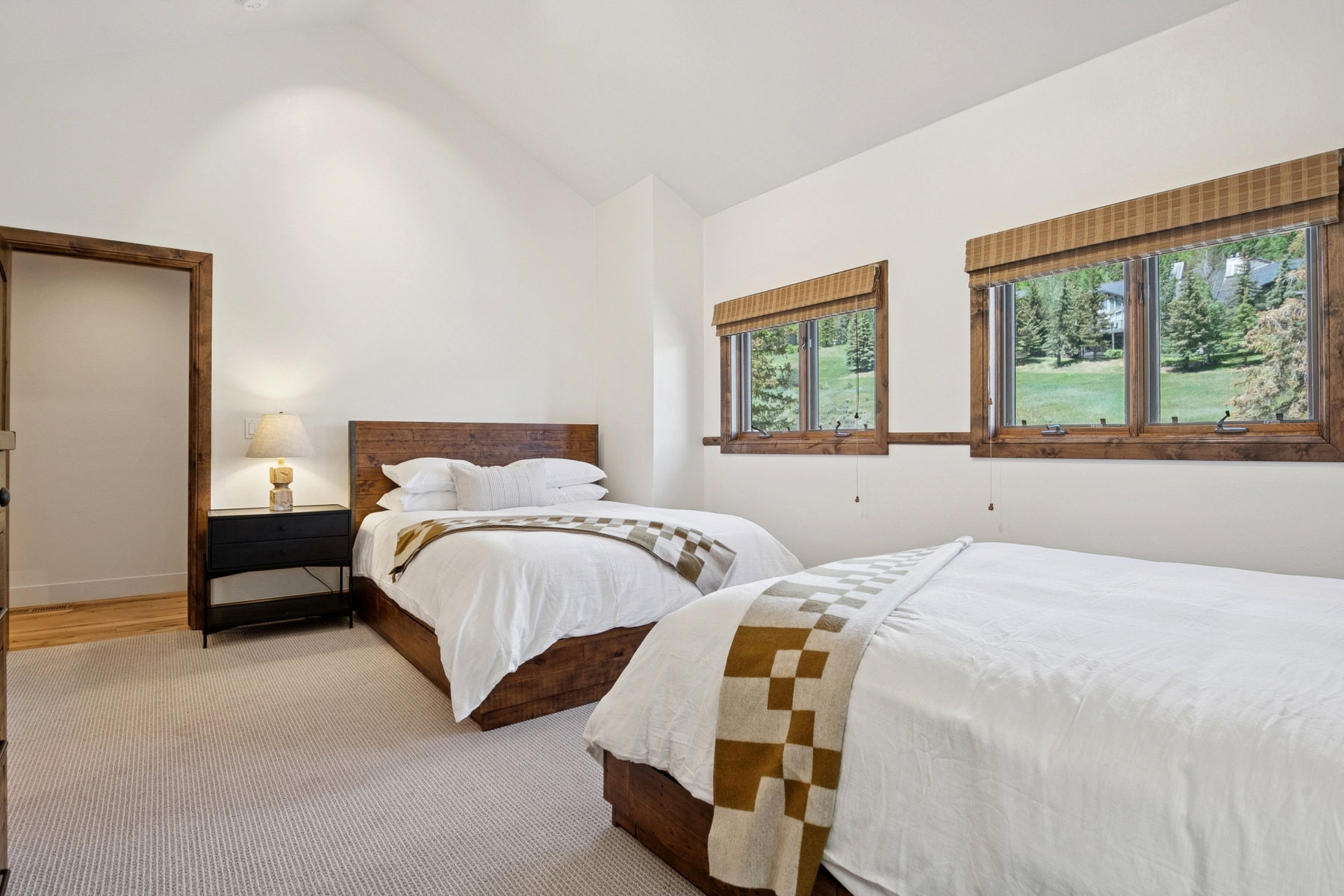Vaulted ceilings complement the neutral color palette in this space