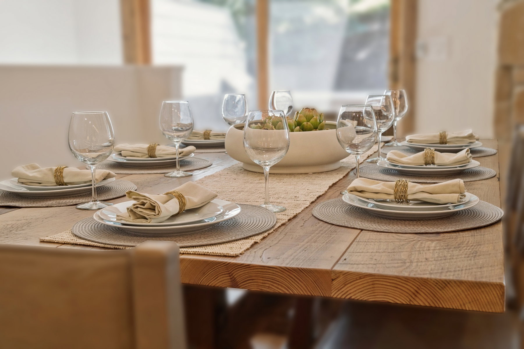 Solid wood dining table featuring a thick, visible grain