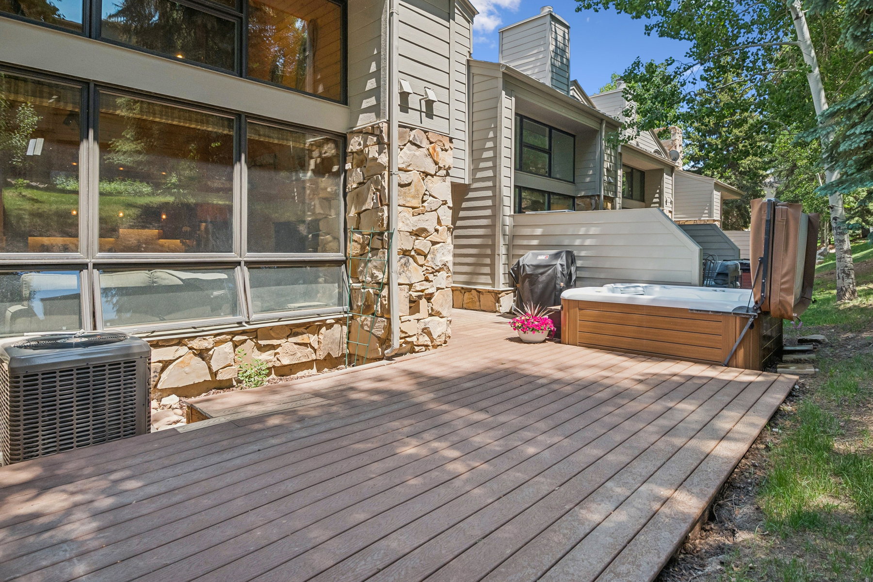 Expansive outdoor deck featuring wood-finish flooring