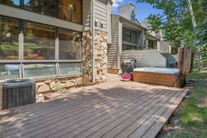 Expansive outdoor deck featuring wood-finish flooring