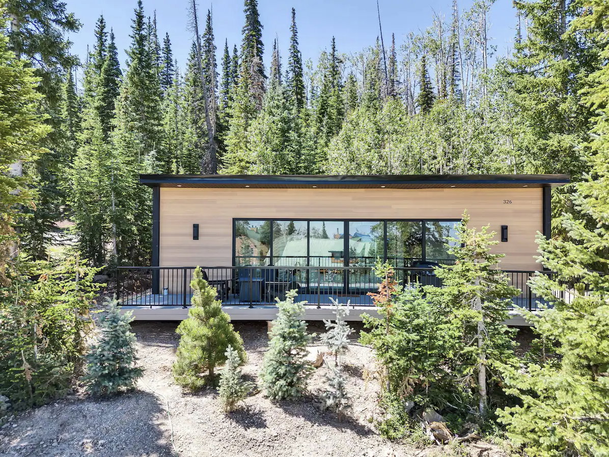 Contemporary exterior with wood-finish siding and a flat roofline
