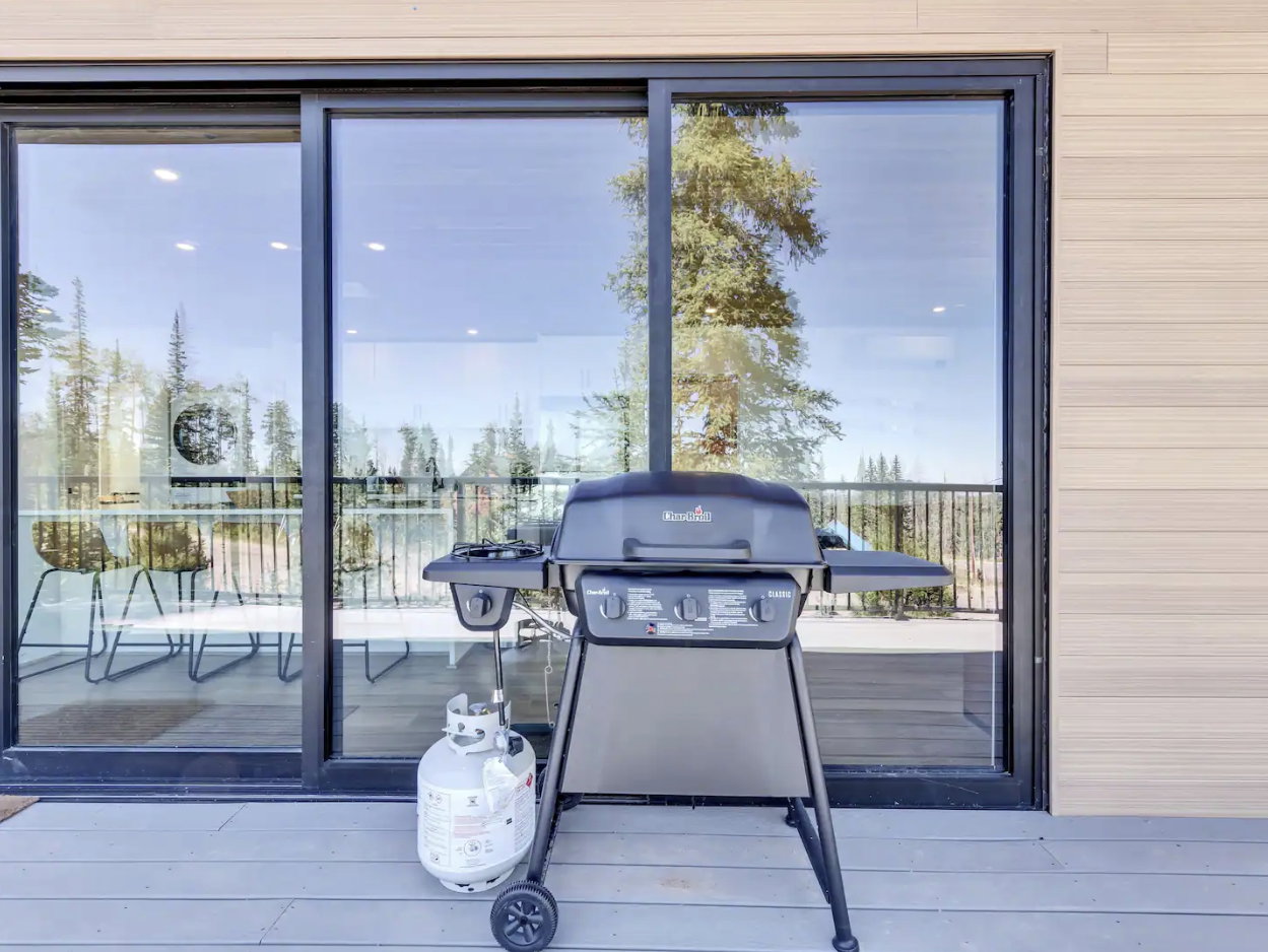 Exterior deck featuring composite decking and black metal railing