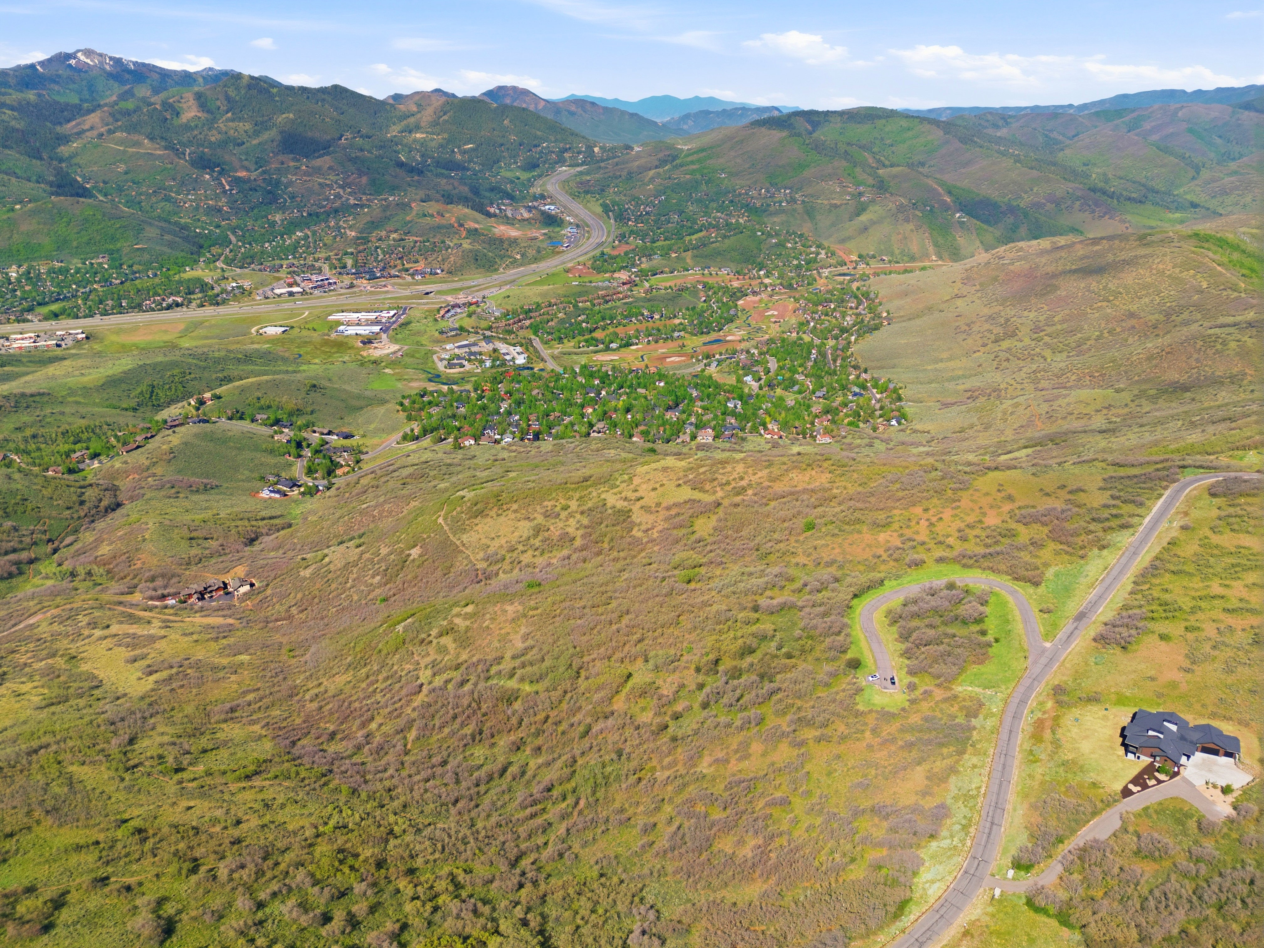 Expansive land parcel featuring a paved drive with a turnaround