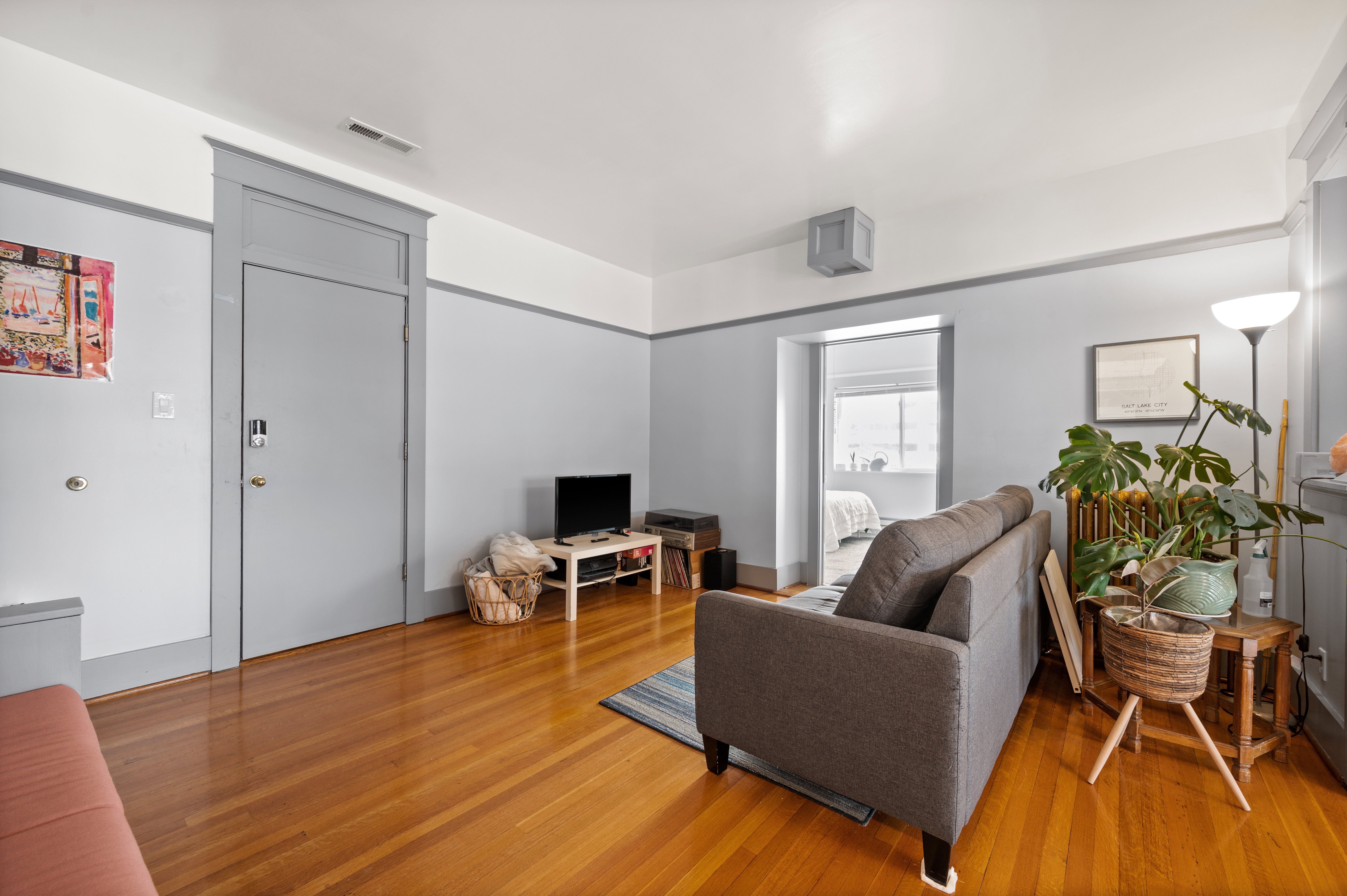 Hardwood flooring extending throughout the room