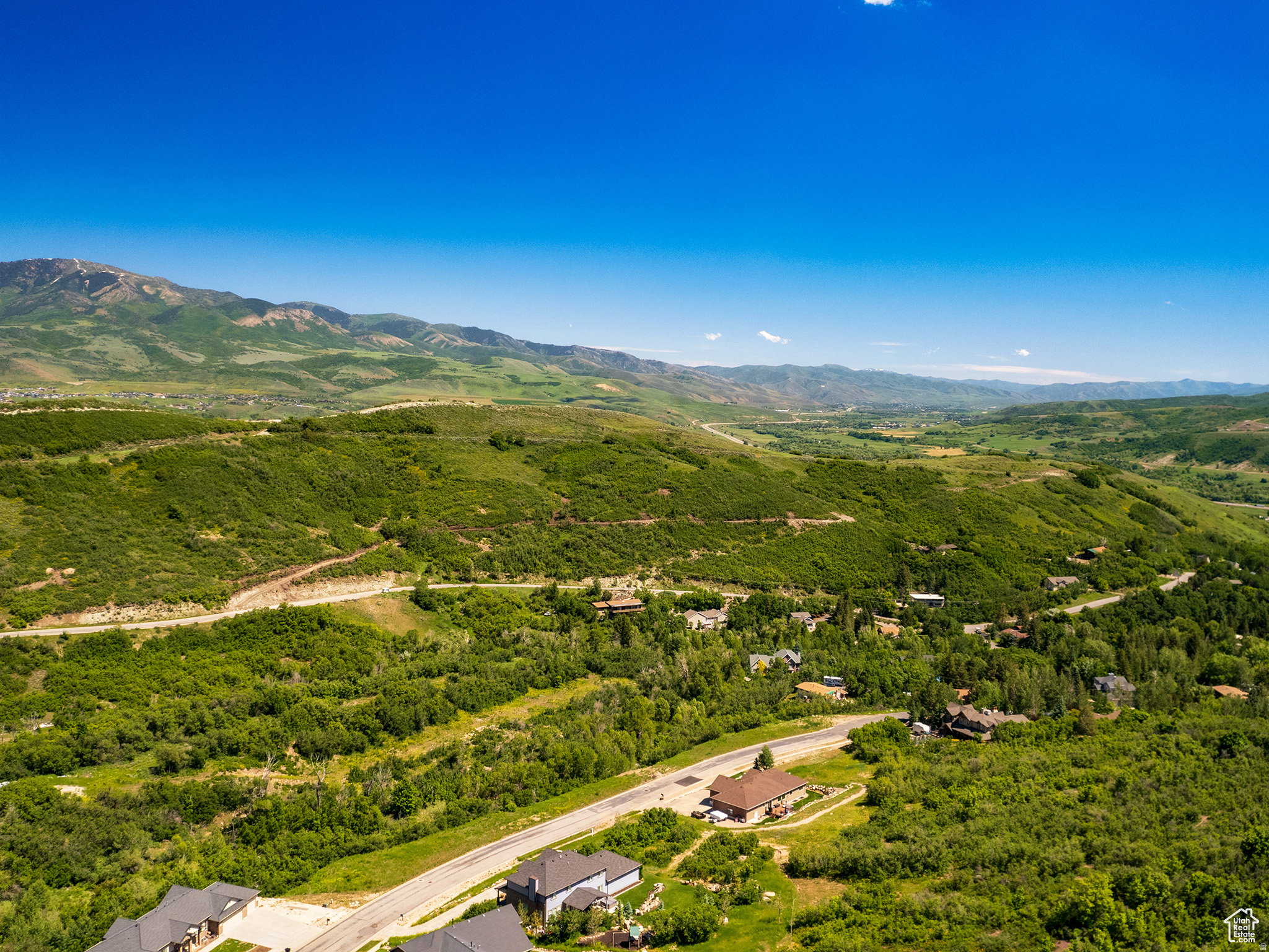 Expansive mountain scenery with verdant hillsides